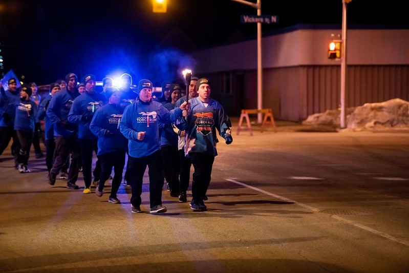 A group of people running at night