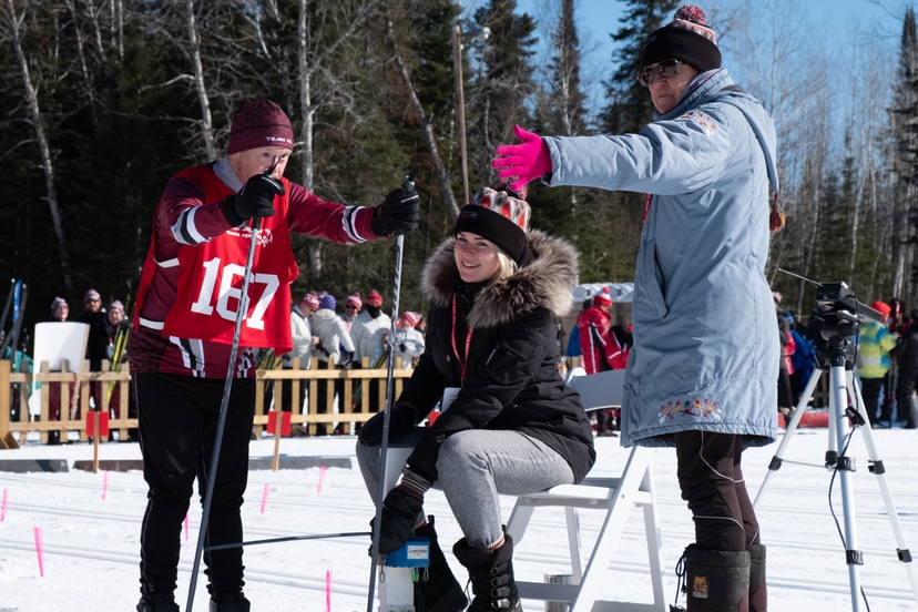 Athlete and Coach preparing for the start of the Cross-country skiing